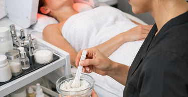 Luxury electric facial bed designed for specialized spa services like microdermabrasion and LED therapy in a professional treatment room setting.
