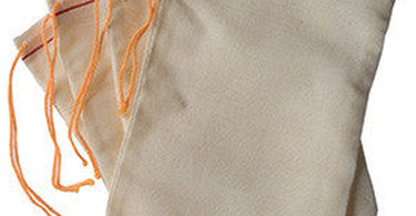 Facial Herbal Infusion - Muslin Bags / 4 Pack by Amber Products on a spa treatment station
