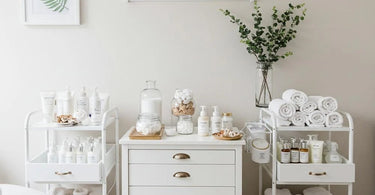 Spa treatment room stocked with professional supplies including cotton rounds, waxing tools, massage oils, and rolling carts