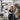 A stylist turned salon owner confidently reviewing an inventory clipboard in a well-organized, modern salon stock room