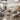 A stylish and durable spa treatment room featuring a modern electric massage table, emphasizing the concept of furniture as a service for professional use.