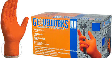 Close-up image of Gloveworks HD Orange Nitrile Industrial Gloves showing the textured diamond grip and bright orange color.