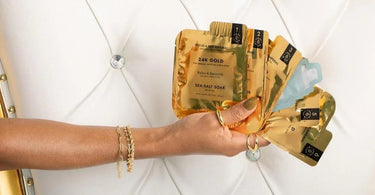 Luxurious Voesh Imperial Gold 6-Step Pedicure treatment featuring gold-infused products on a spa tray