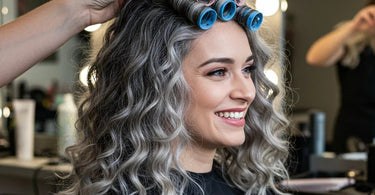 Gray-haired woman with gorgeous curls after a professional perm