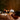Hot stone massage therapy in a spa setting, showcasing basalt stones and a relaxing ambiance