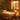 Professional massage bed in spa setting with folded towels and essential oils