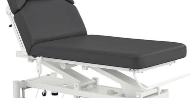 A heavy-duty tattoo chair with adjustable features, designed for maximum weight capacity and client comfort.