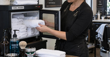Professional barber hot towel setup with warm towels ready for shaving services