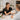 A spa professional is reviewing a facial add-on menu with a client, showcasing time-based treatment options.