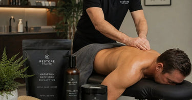 Pure Spa Direct Restore wellness recovery bundle with massage oil, recovery balm, and magnesium bath soak for professional spas and salons.