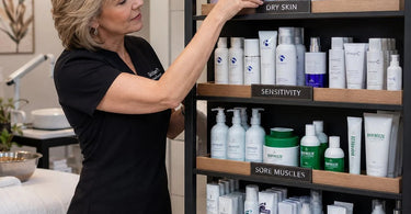 A professionally designed spa retail shelf display showcasing products that solve common client complaints, such as ingrown hair treatments, hydrating serums, and long-lasting nail care.