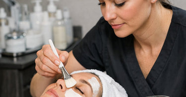Salon owner calculating true hourly rate with calculator, spa supplies, and financial charts representing profit margin analysis and business cost breakdown