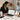 Woman looking at scheduling software on tablet in a spa setting with massage table and towels