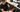 A close-up image showing a salon professional expertly applying a black neck strip to a client, ensuring a clean and comfortable haircut experience.
