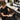 A close-up image showing a salon professional expertly applying a black neck strip to a client, ensuring a clean and comfortable haircut experience.