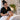 Spa professional providing a relaxing treatment to a quiet client in a calm treatment room with warm lighting and professional equipment