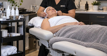 Accessible facial setup with adjustable hydraulic facial bed, bolsters, and facial steamer for clients with limited mobility in a spa treatment room