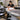 Accessible facial setup with adjustable hydraulic facial bed, bolsters, and facial steamer for clients with limited mobility in a spa treatment room