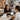 A spa professional and a client smiling during a friendly rebooking conversation at the checkout counter, highlighting effective client retention strategies.