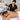 A professional spa setup for large body waxing featuring a large capacity wax warmer, roll-on wax cartridges, and organized tools.