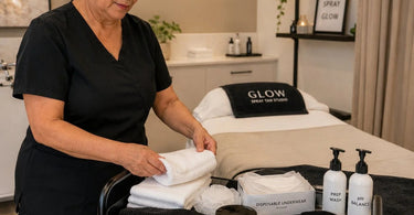 A clean and professional spray tan prep station setup featuring disposable underwear and sanitizing wipes for a hygienic client experience.