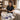 A professional esthetician organizing disposable supplies for a spa treatment, representing smart reorder point strategy