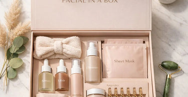 Assorted professional spa skincare products and tools laid out neatly, ready to be assembled into a post-treatment Facial in a Box home care kit.