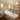 Relaxing spa treatment room with massage table, soft lighting, and luxury decor