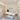 Minimalist lash studio design with neutral tones, sleek furniture, and soft lighting