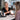 A professional spray tanning session in progress at a salon, highlighting the importance of explaining development time to clients