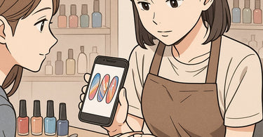 Nail technician working on client's nails with Pinterest inspiration photos visible on phone