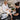 A professional esthetician consulting with a client about varicose veins before a waxing service.
