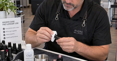 Nail technician easily opening a gel polish bottle with clean threads and no stuck cap