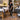 Professional massage treatment room with clean flooring and organized massage supplies for preventing slippery floors and massage oil buildup