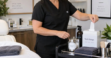 Professional salon station with neck strip dispenser keeping strips dry and accessible for barber and beauty services