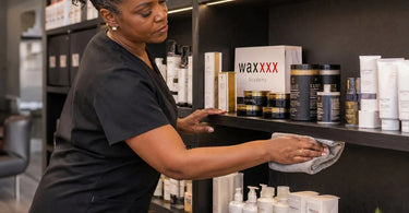 A well-organized and aesthetically pleasing spa retail shelf display, featuring a variety of professional beauty and wellness products, demonstrating an effective and efficient cleaning and merchandising strategy.
