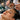 Aesthetician's hands professionally layering facial serums on a client's skin during a customized spa treatment