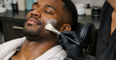 How to maintain the finish on professional salon furniture: cleaning supplies and a microfiber cloth next to a modern salon chair