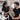 Man getting eyebrow tinting treatment in a modern barbershop chair by a professional esthetician