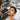 Professional male client receiving lash tinting service at a modern spa with eyes closed and technician applying tint
