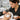 Salon owner confidently reviewing a lease agreement with a landlord, symbolizing successful negotiation for spa and salon spaces.