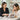 A professional hair colorist consulting with a client, examining hair color with a thoughtful and compassionate expression.