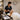 A busy spa and salon schedule with add-ons causing delays, and a calm professional managing the timetable efficiently with Pure Spa Direct products.