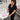 Nail technician using a cordless nail drill to prevent cord drag during a professional manicure service in a clean salon environment.
