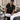 A professional massage table with a white face cradle cover securely fitted, demonstrating how to prevent shifting during services for client comfort and hygiene.