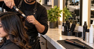 Professional salon station with heat resistant mat protecting the countertop from a hot curling iron and flat iron.