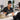 Beauty professional managing appointment schedule while client films social media content in a modern spa treatment room