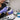 Nail Technician sanitizing a professional nail drill bit in a salon setting
