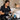 A professional wax applicator being properly sanitized with a disinfectant spray and clean wipes in a salon setting.
