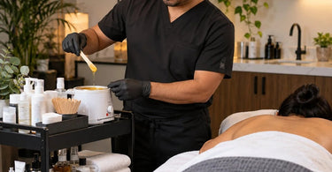 Beauty professional arranging frequently used tools and supplies within comfortable reach at an organized spa or salon workstation